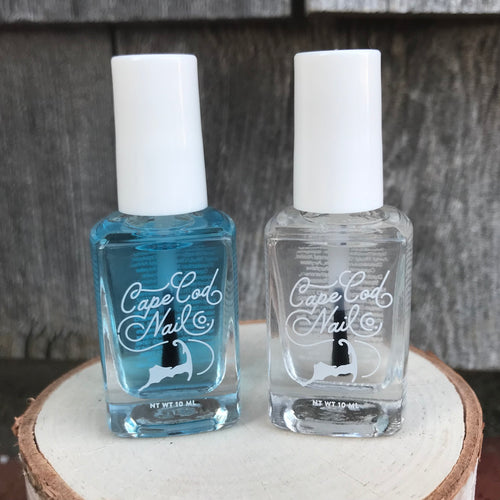 Two bottles of nail polish, one with a blue liquid and the other with a clear liquid, both labeled 'CAPE COD NAIL CO'.